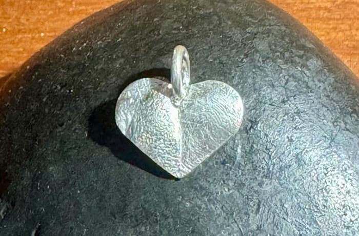 Heart-shaped nose and paw-print pendant